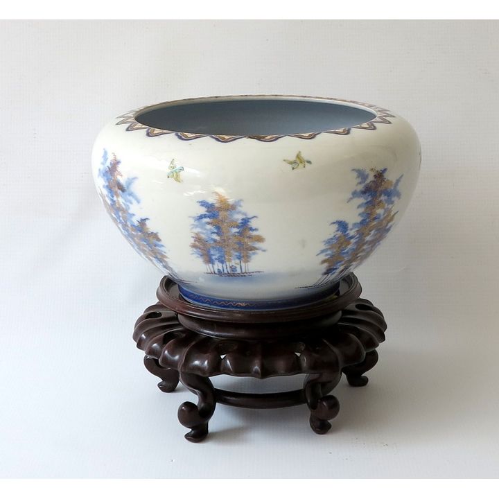 CHINESE PORCELAIN BOWL ON CARVED WOODEN STAND