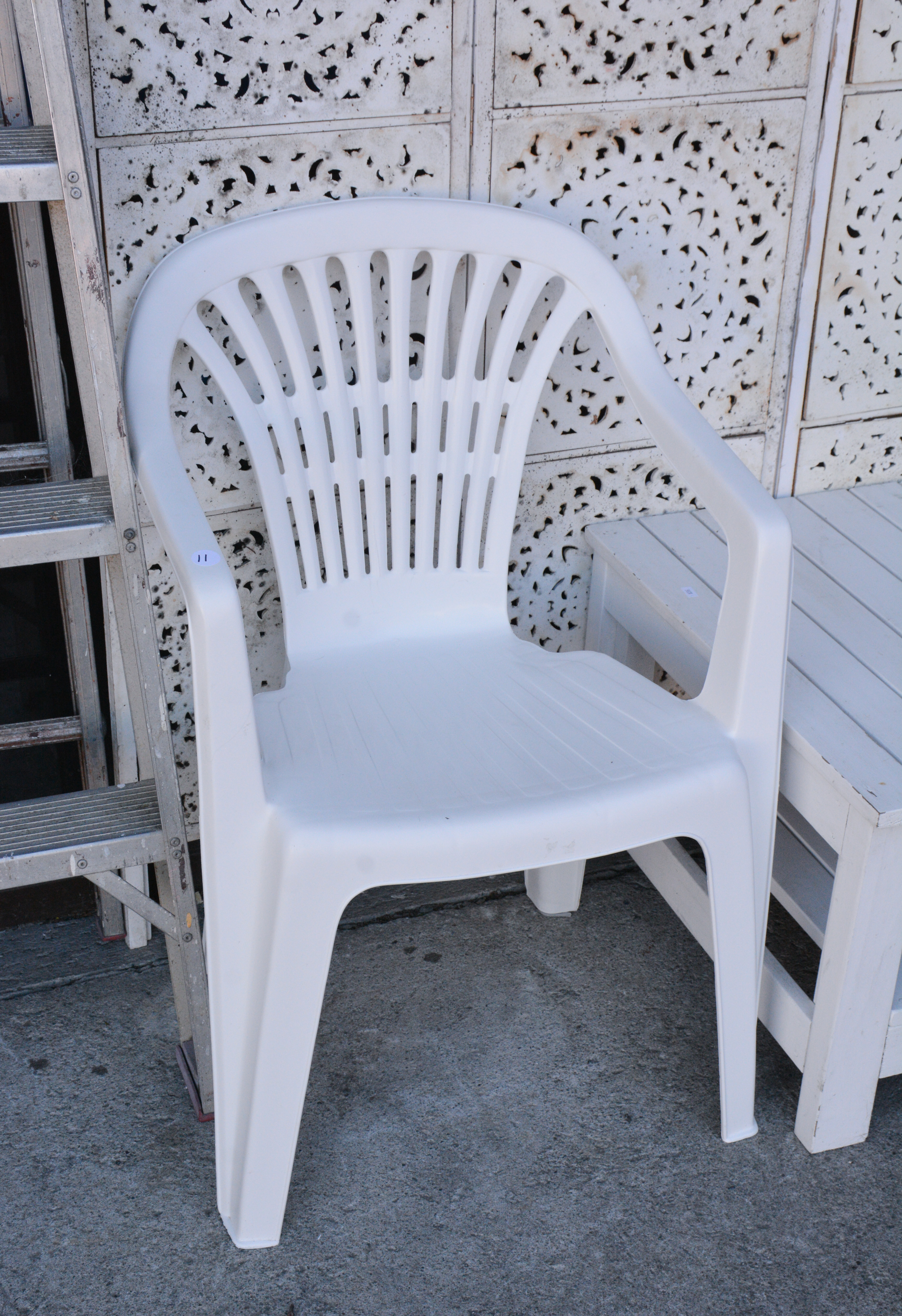 White Resin Outdoor Chair — sold at auction in New Zealand for $5
