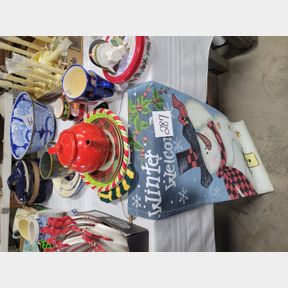 Assorted Christmas serving pieces and decorative banner