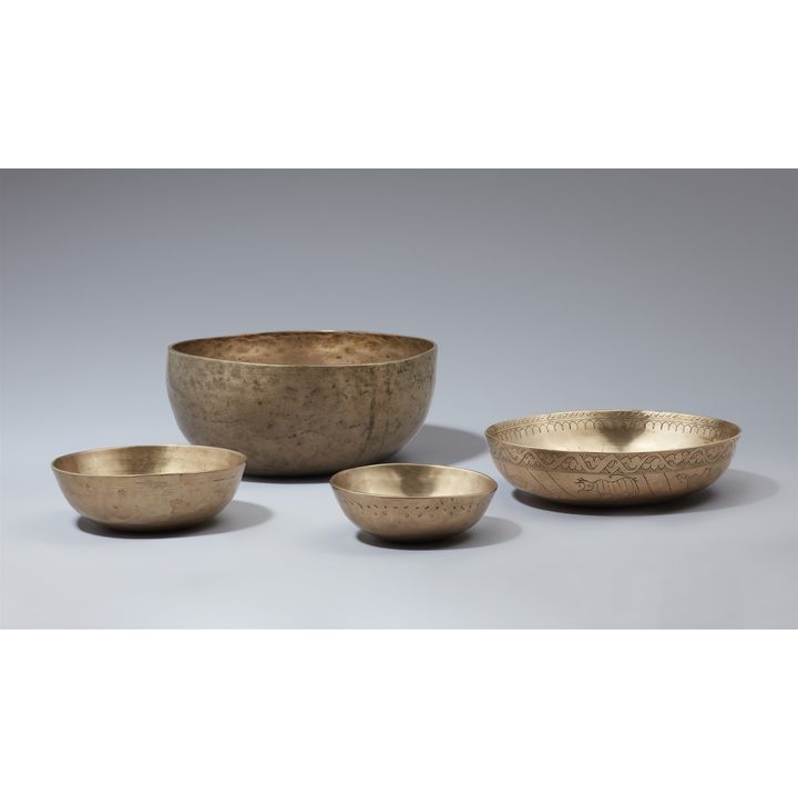 A group of four brass 'singing bowls'. India. 20th century