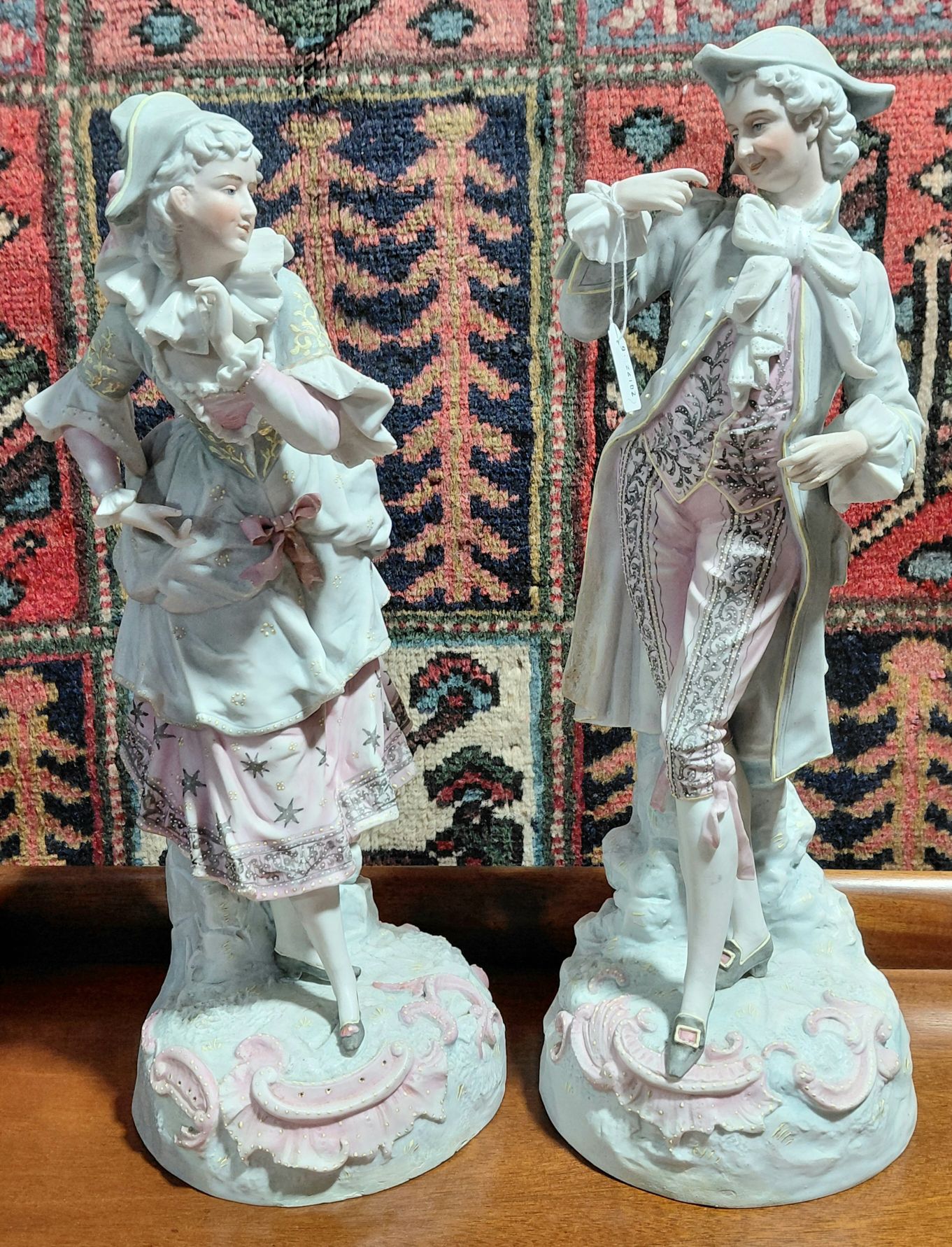 607 · PAIR OF BISQUE FIGURINES