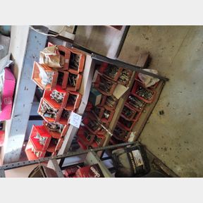 Numerous containers of new and used bolts and hardware