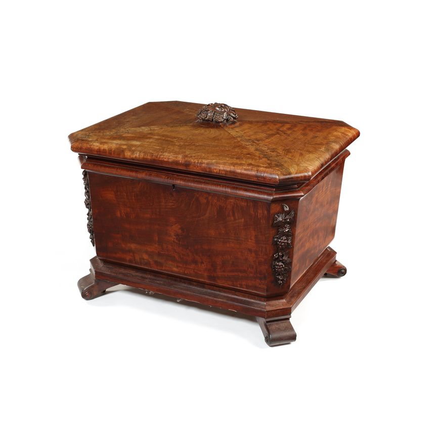 A large early Victorian carved mahogany wine cooler