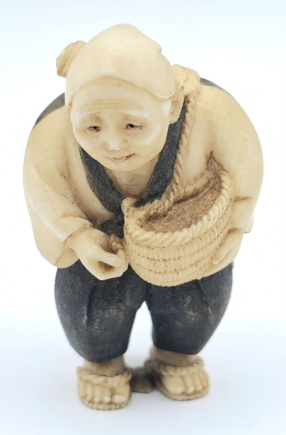21 · JAPANESE CARVED IVORY NETSUKE