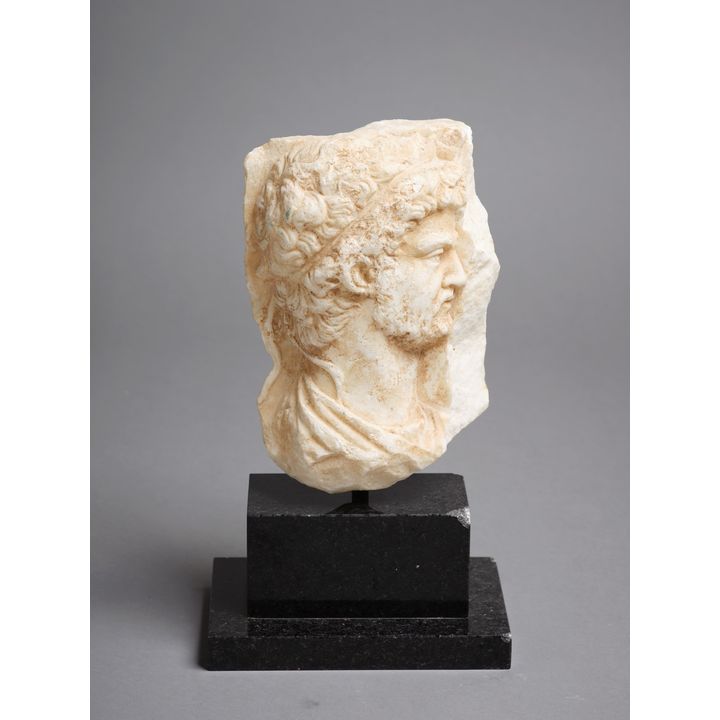 A decorative carved stone Roman-style head