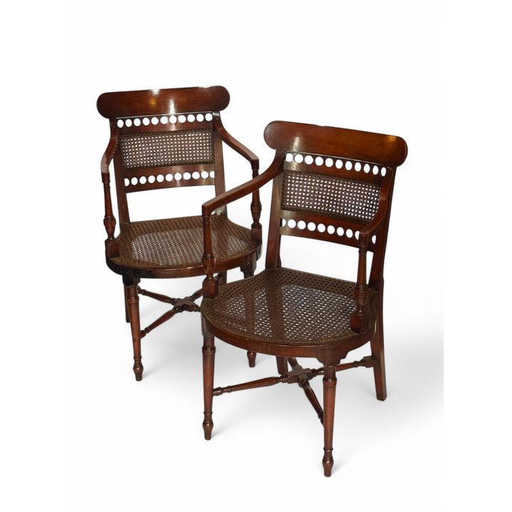 A pair of late George III mahogany open armchairs
