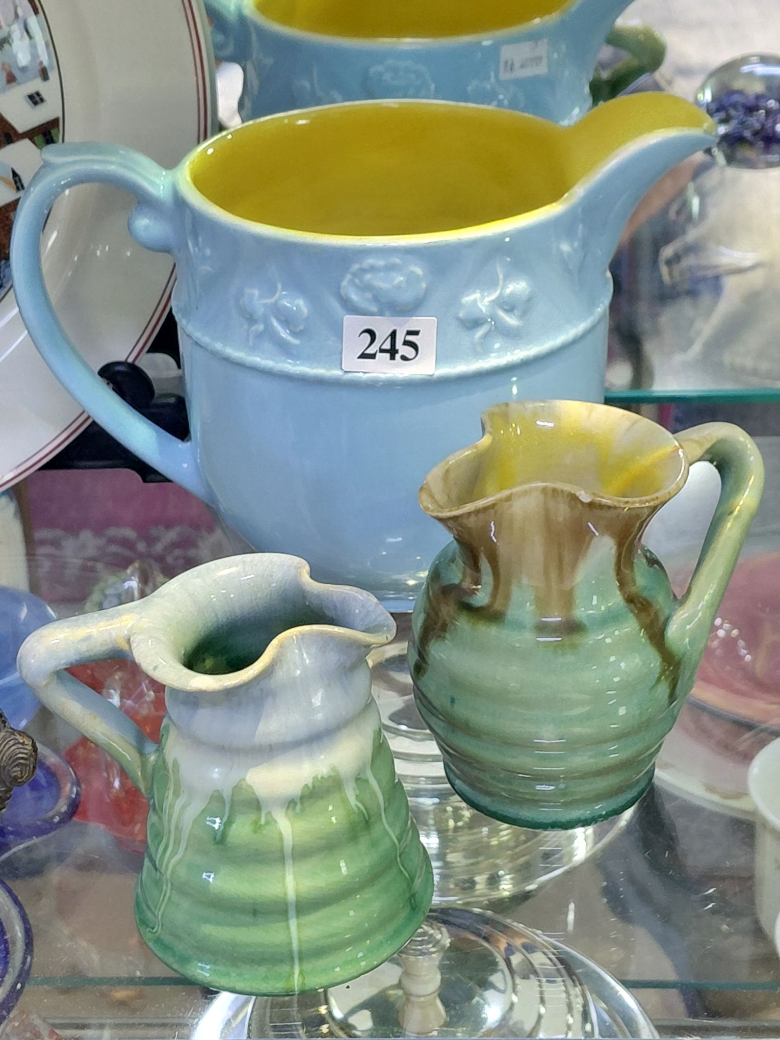 245 · THREE GLAZED JUGS