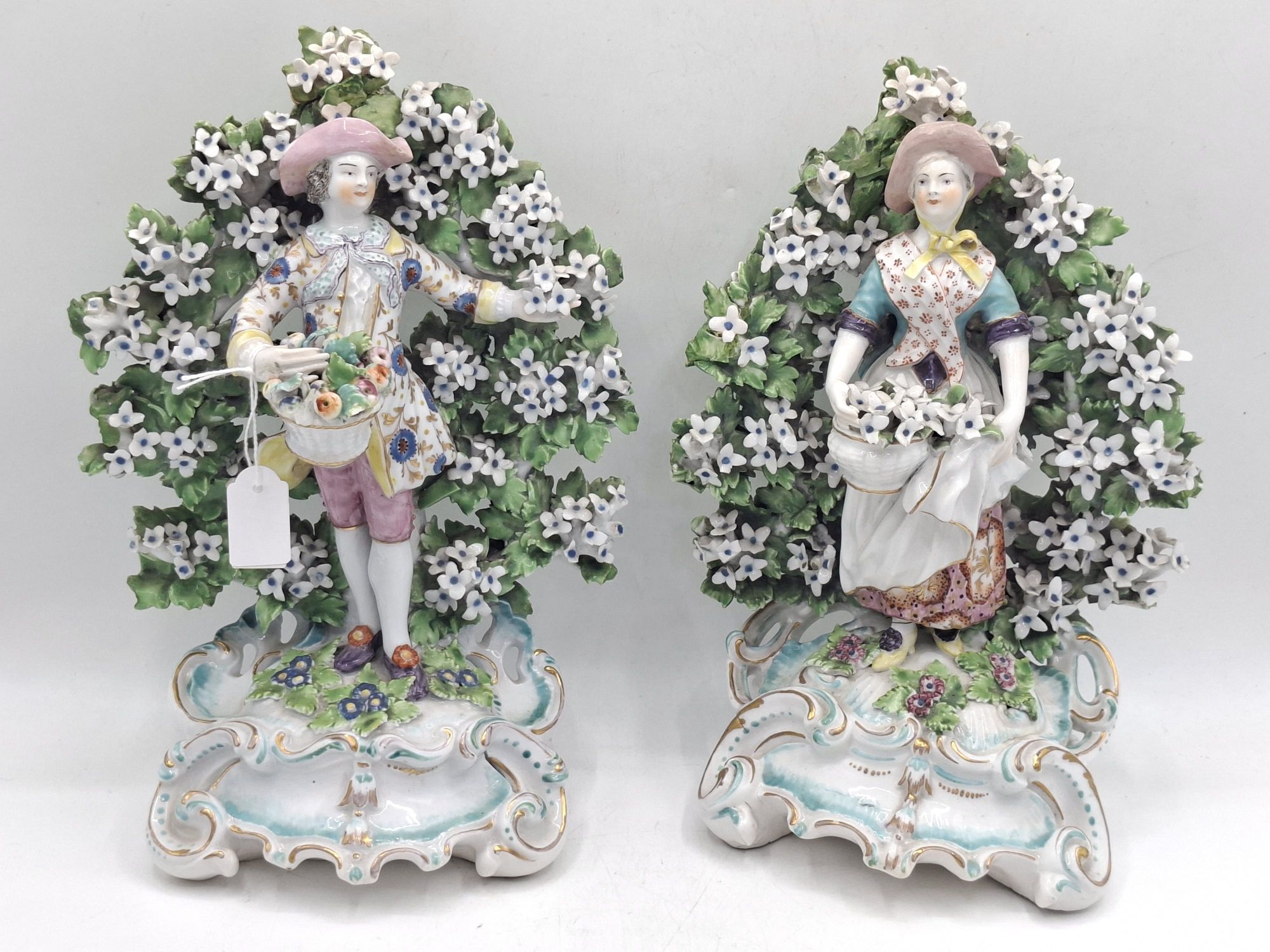 63 · PAIR OF MANTLEPIECE FIGURINES