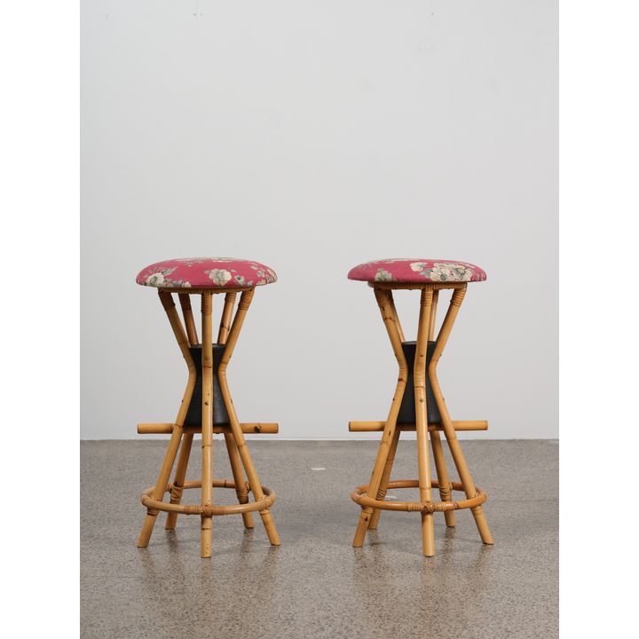 A pair of retro ‘Hawaiian’ bar stools - in nice condition, of hourglass form with fivepoint cane bases and floral upholstery to seat pads