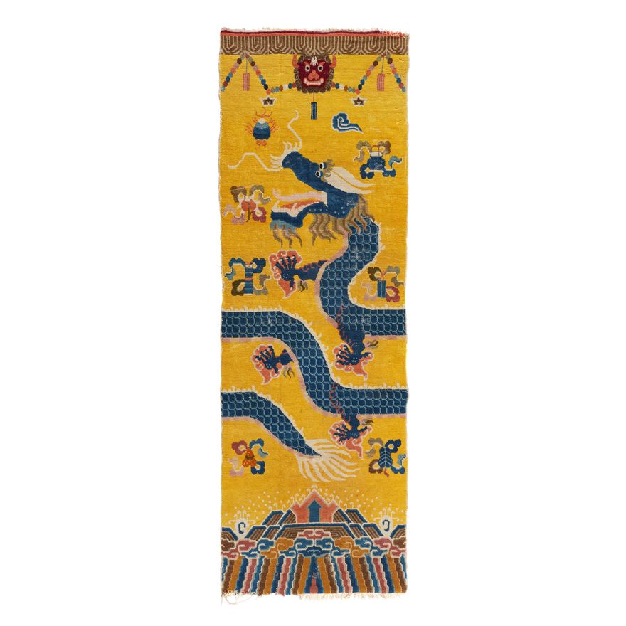 A yellow ground Ningxia wool pillar carpet. 19th century
