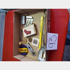 Box of Coffeyville items, tokens, spoon, openers