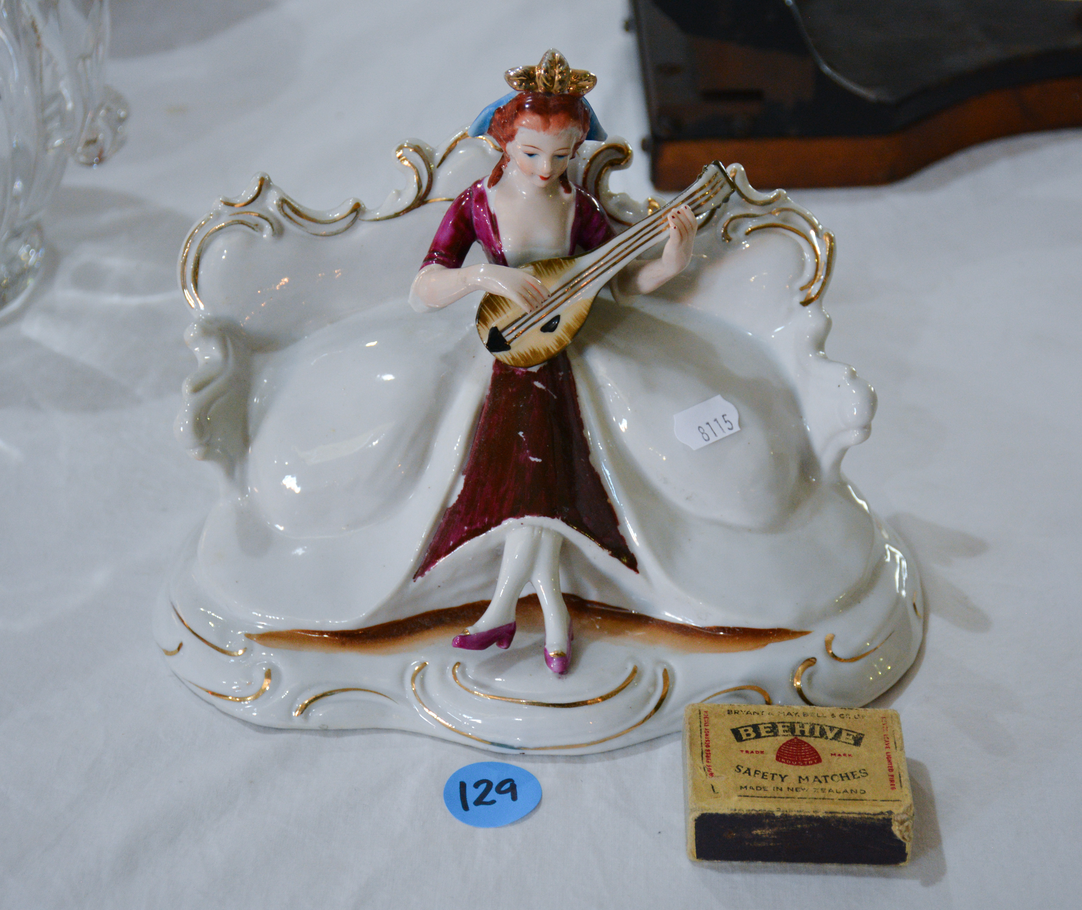 Musician Woman on Couch - Ornament — NZ auction result
