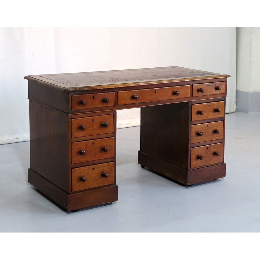 VICTORIAN LEATHER INLAID MAHOGANY PEDESTAL DESK on castors