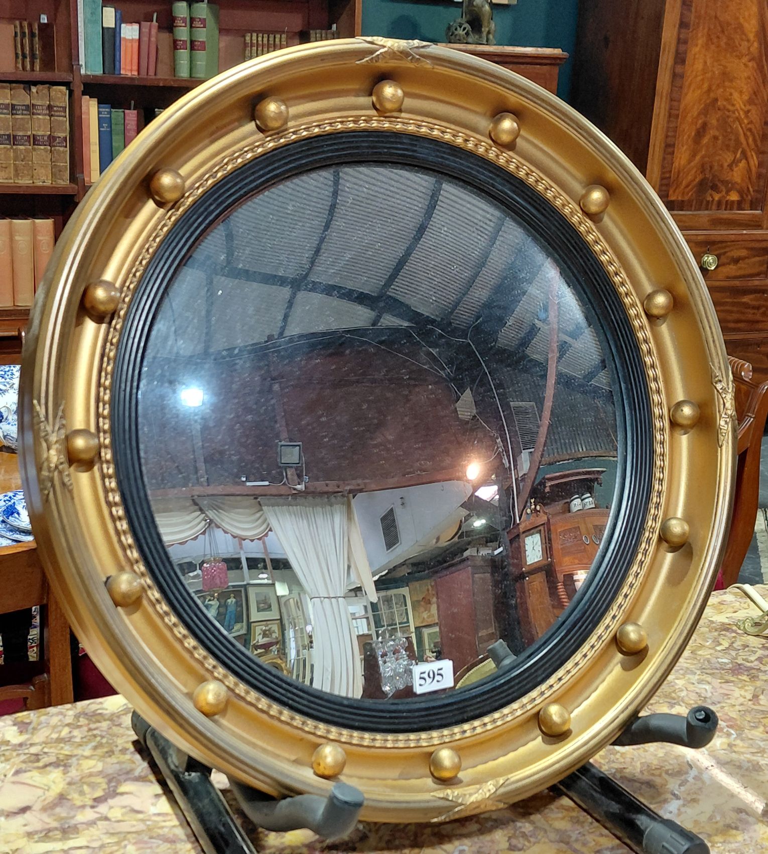 595 · A REGENCY STYLE CONVEX MIRROR
