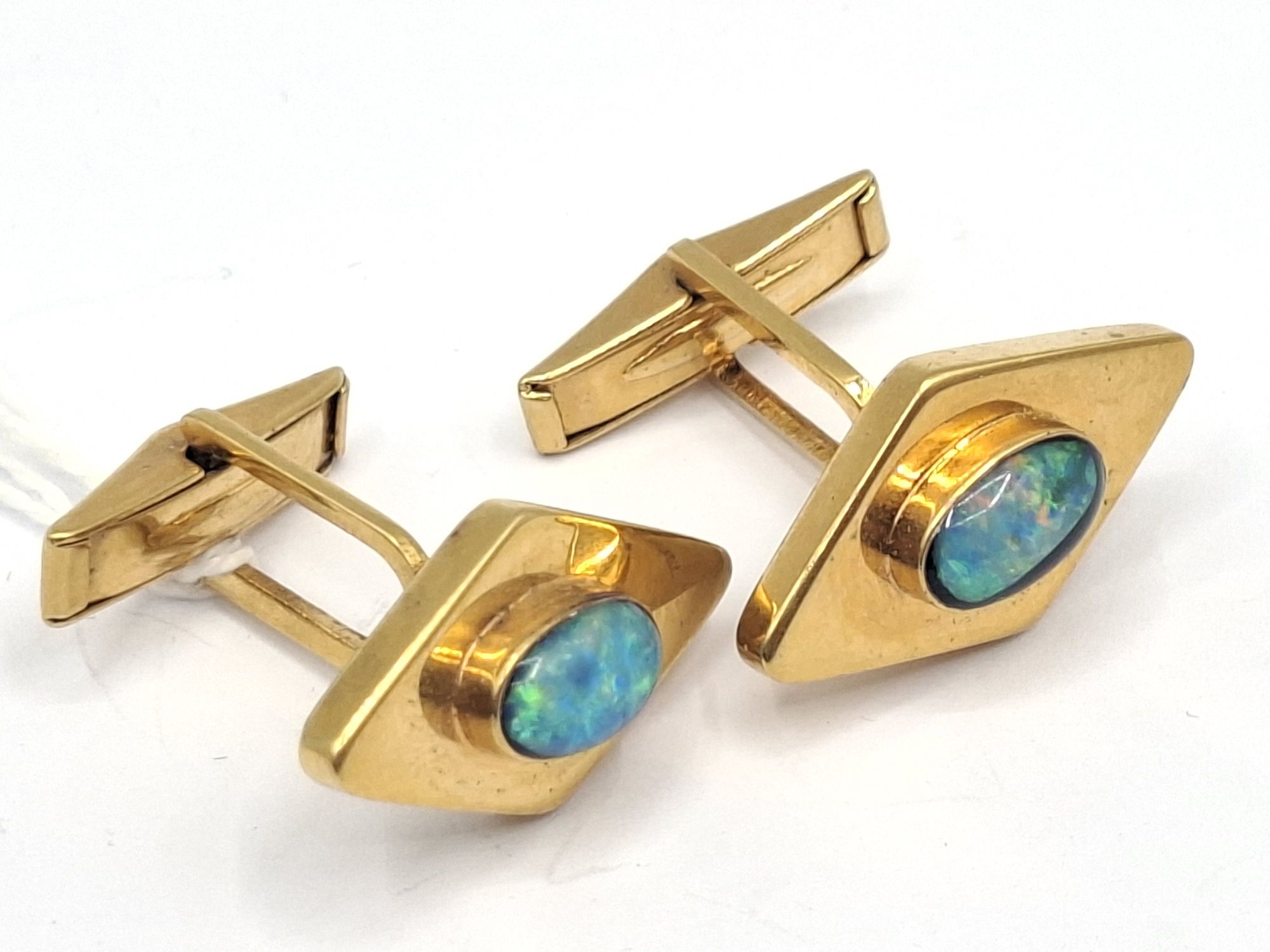 A Pair Of Silver Gilt Opal Cufflinks