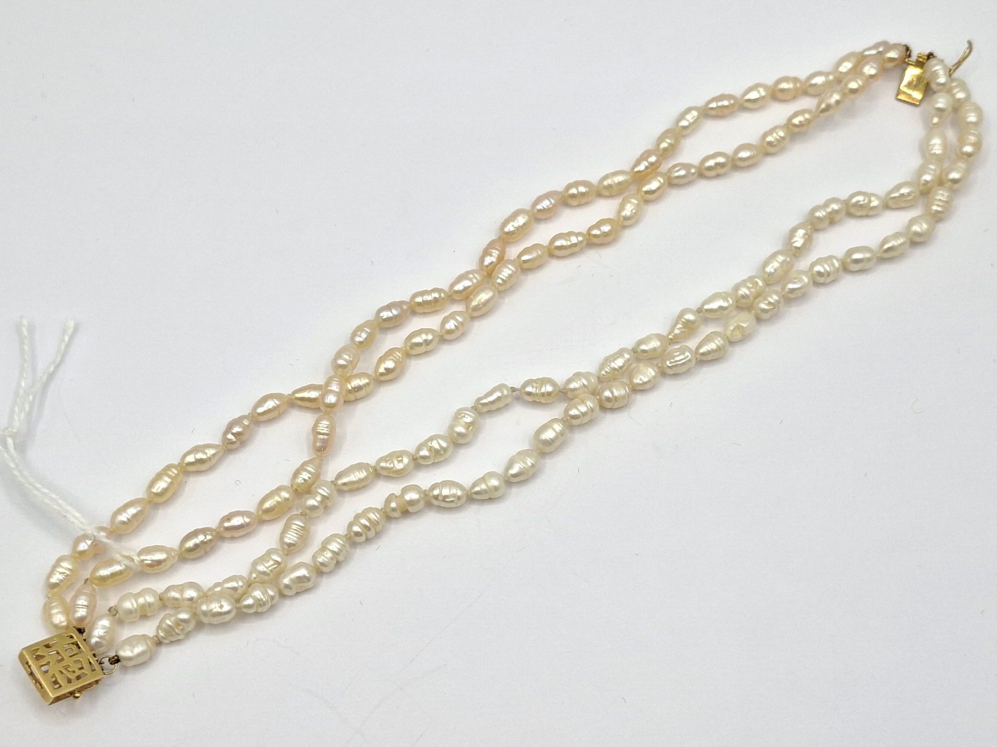 1161 · FOUR STRAND SEED PEARL BRACELET