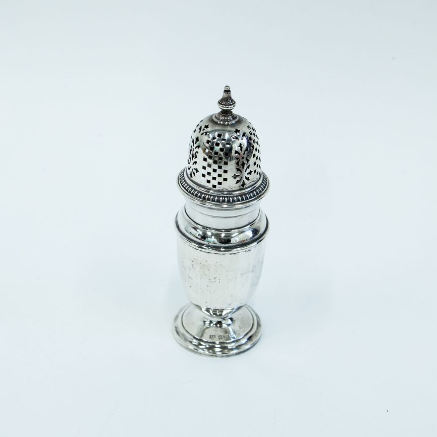 A silver sugar caster