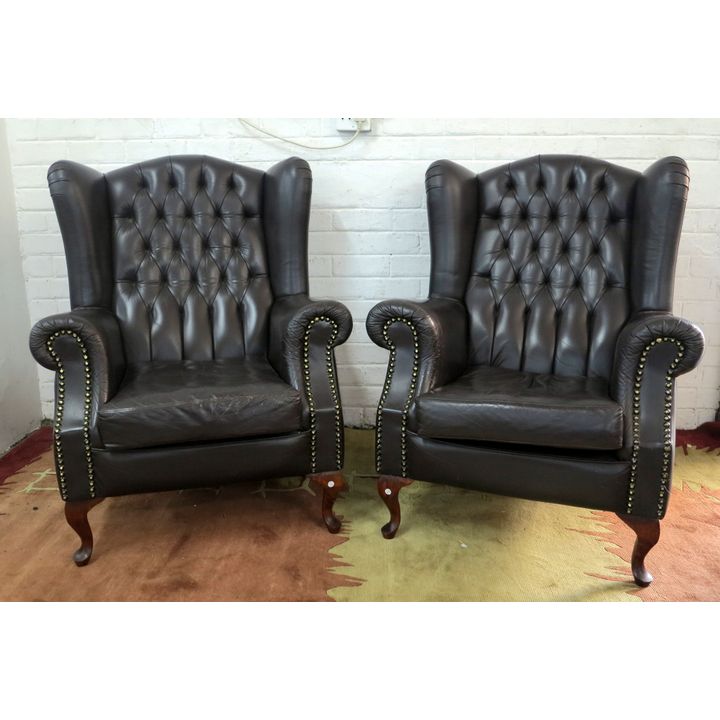 PAIR OF BUTTON UPHOLSTERED LEATHER WINGBACK CHAIRS
