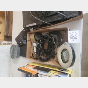 Clip on magnifier light and shot gun bandelier with other items