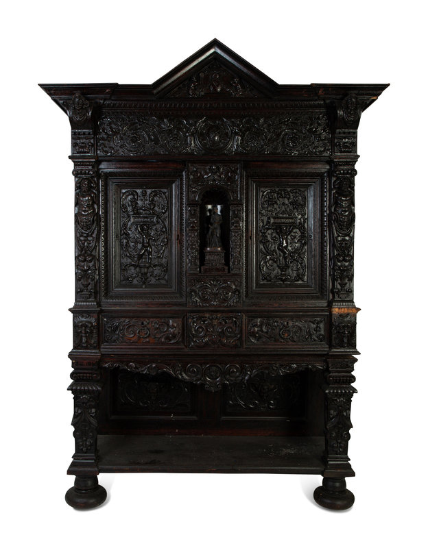 An Italian Baroque Style Carved Oak Cabinet on Stand
Height 88 1/2 x width 61 3/3 x depth 26 inches.