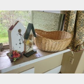 Basket of vintage recipes and house decorations