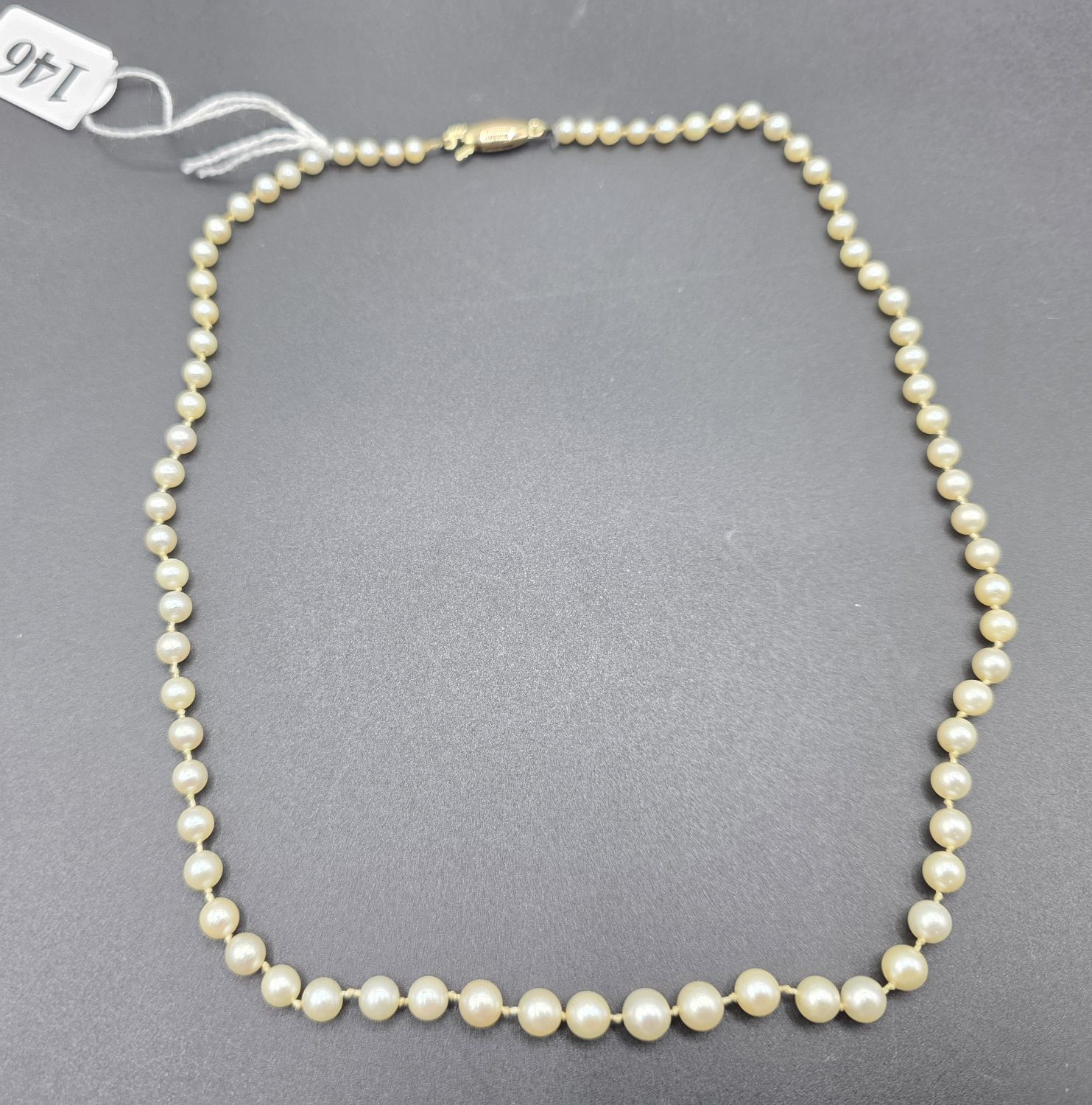 146 · GRADUATED STRAND PEARL NECKLACE