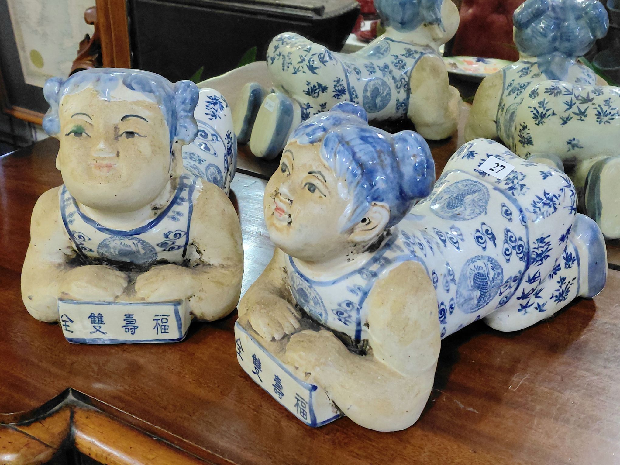 27 · A PAIR OF CHINESE FIGURAL PILLOWS