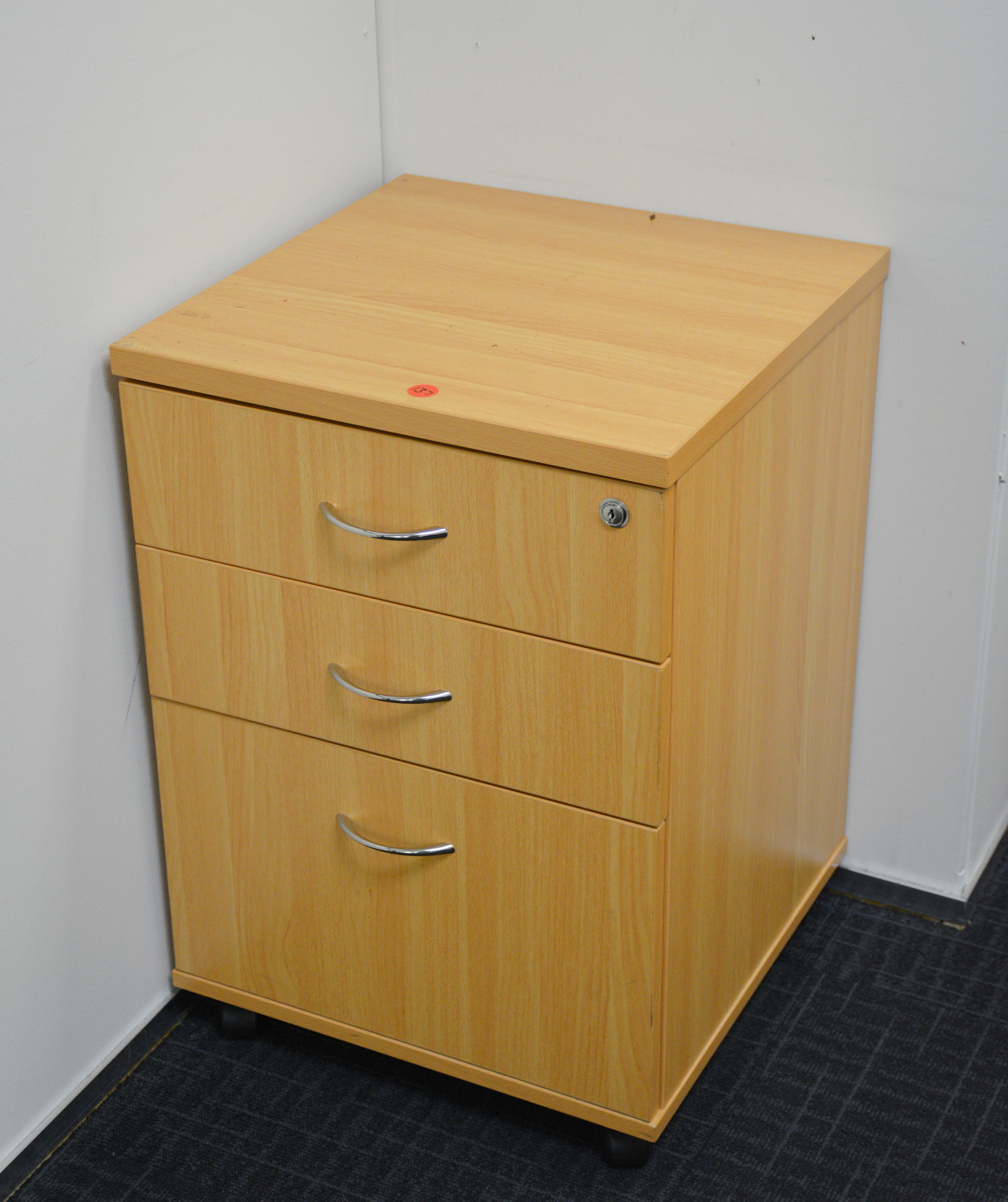 Wood Three Drawer Office Unit — sold at auction in New Zealand for $40