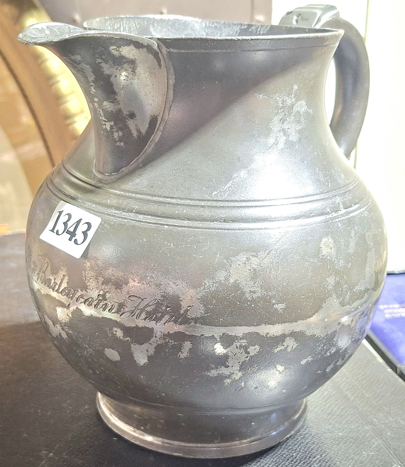 A PEWTER BULBOUS ALE JUG