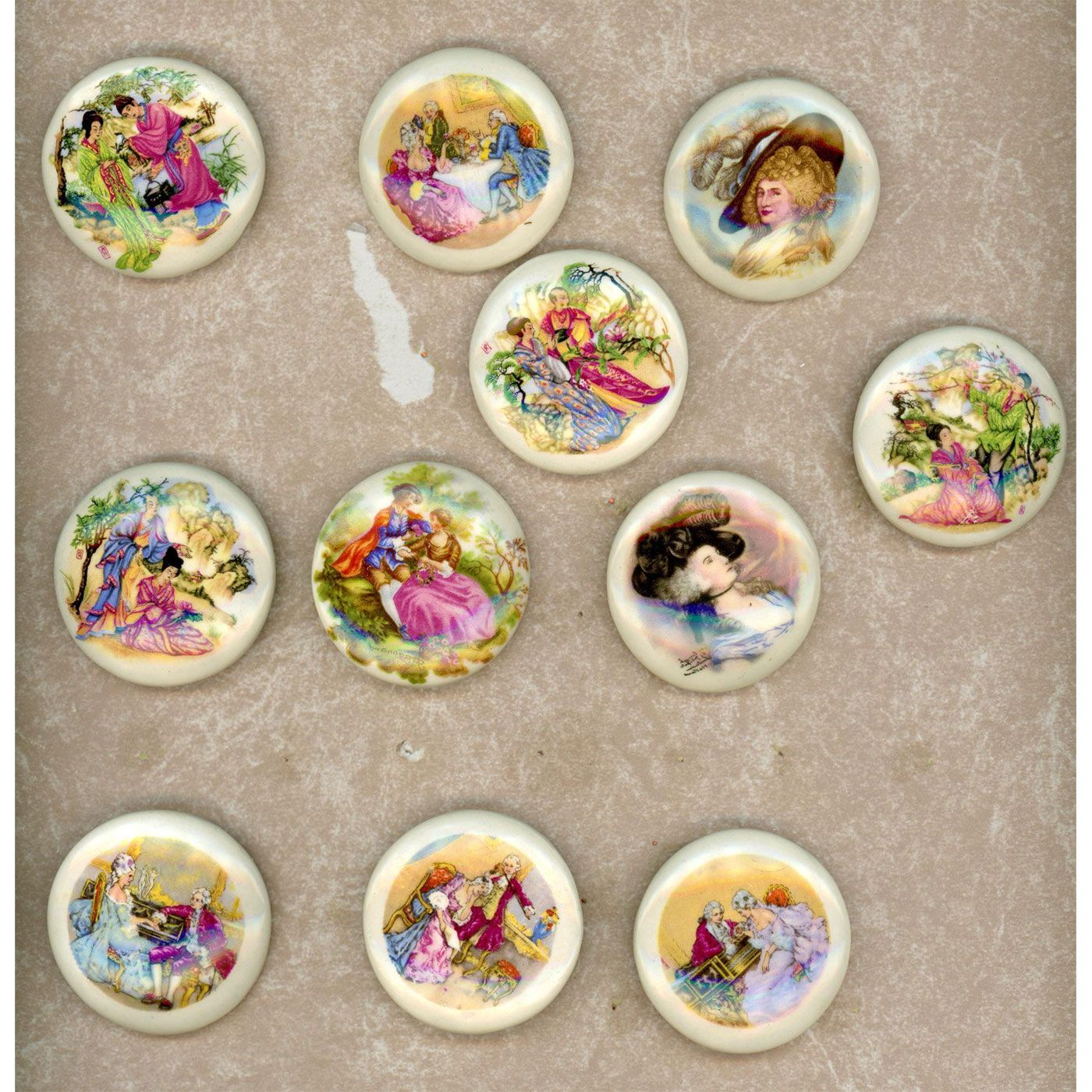 A CARD OF PORCELAIN BUTTONS Lion And Unicorn