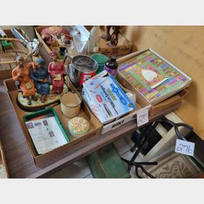 3 Boxes of Black figurines, sifter, and other items
