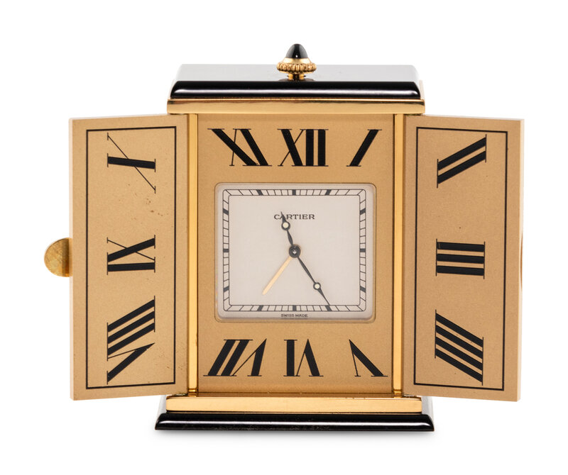 A Cartier Engraved Brass and Onyx Travel Clock