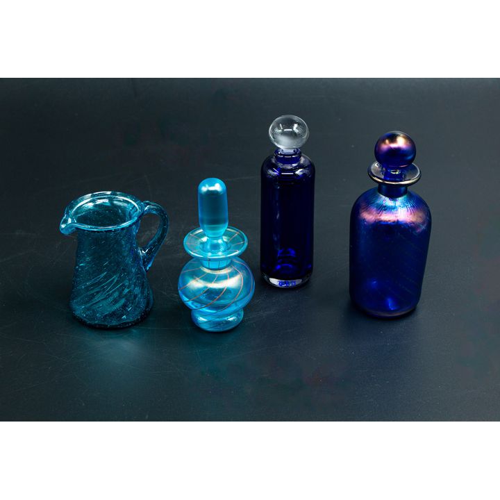 John Abbott, Lesley Justin, and others - Selection of three perfume bottles and one jug