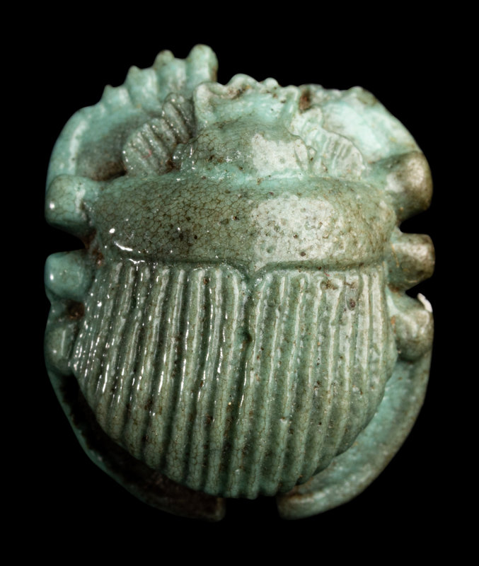 An Egyptian Faience Scarab
Length 1 inch (3 cm).