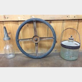 Model A Ford Steering Wheel and 2 Antique Petroleum Containers