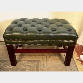 A GOOD QUALITY BUTTON TOPPED GREEN LEATHER FOOTSTOOL, raised on square leg, matches nicely to the next lot. 64