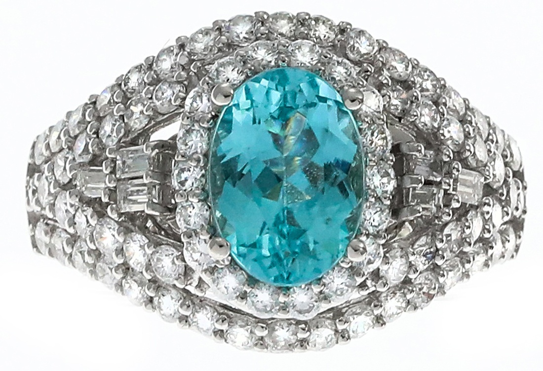 A Tourmaline and Diamond Ring The oval Paraiba tourmaline weighing 1.70 ...