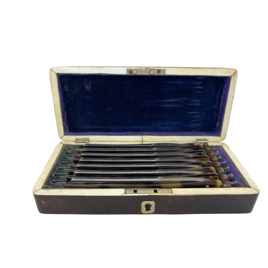 A Victorian tortoiseshell and ivory box of seven razors named for each day of the week by A.W.Stanif