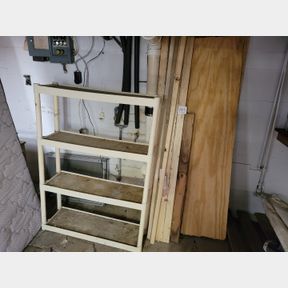 4 Tier plastic shelving unit and misc. lumber and paint
