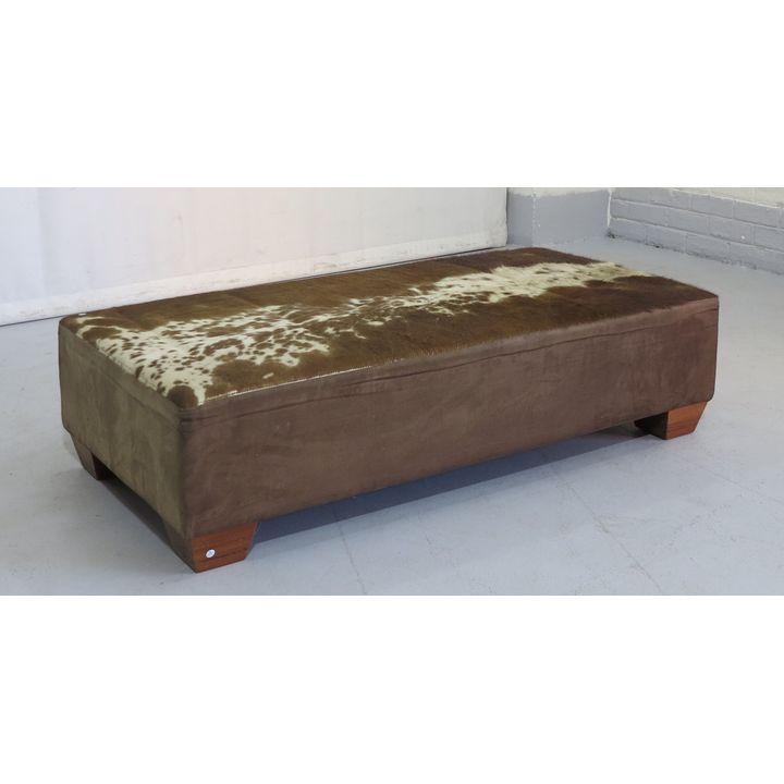 NGUNI HIDE UPHOLSTERED OTTOMAN