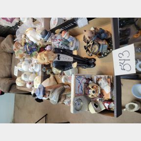 Tazmanian Devil clock, animal figurines, and other decorative items