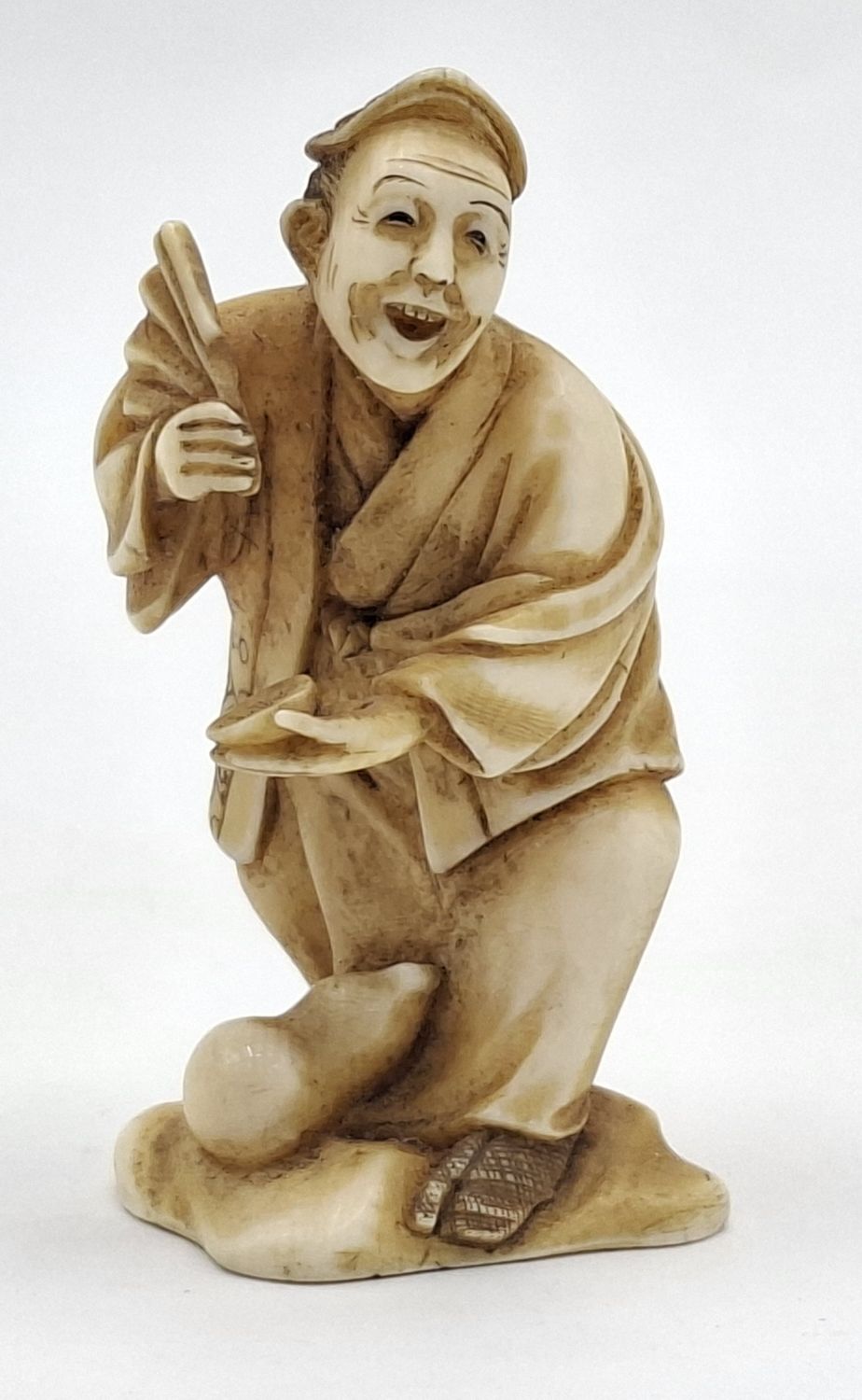 23 · JAPANESE CARVED IVORY FIGURE
