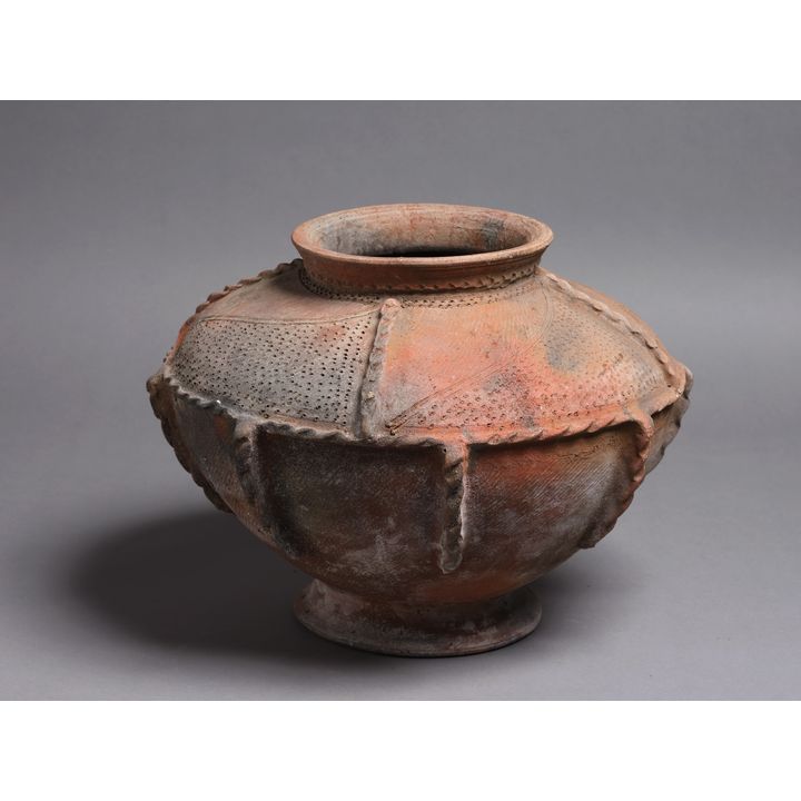 A large and decorative wood fired pottery jar