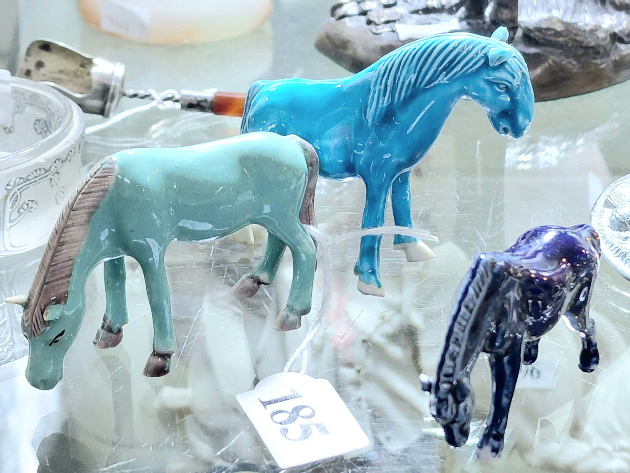 185 · THREE CHINESE GLAZED HORSES