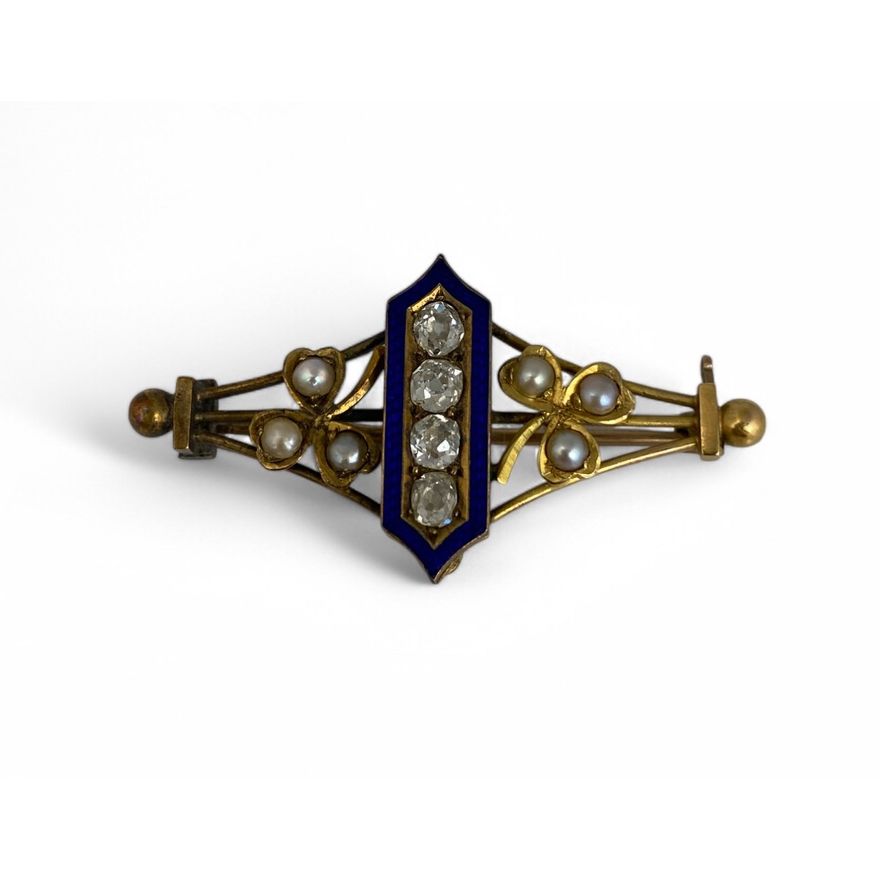 A late 19th / early 20th century diamond, pearl and enamel openwork lozenge shape brooch