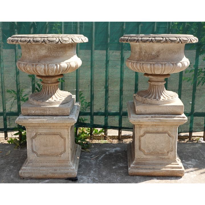 PAIR OF CONCRETE URNS AND STAND