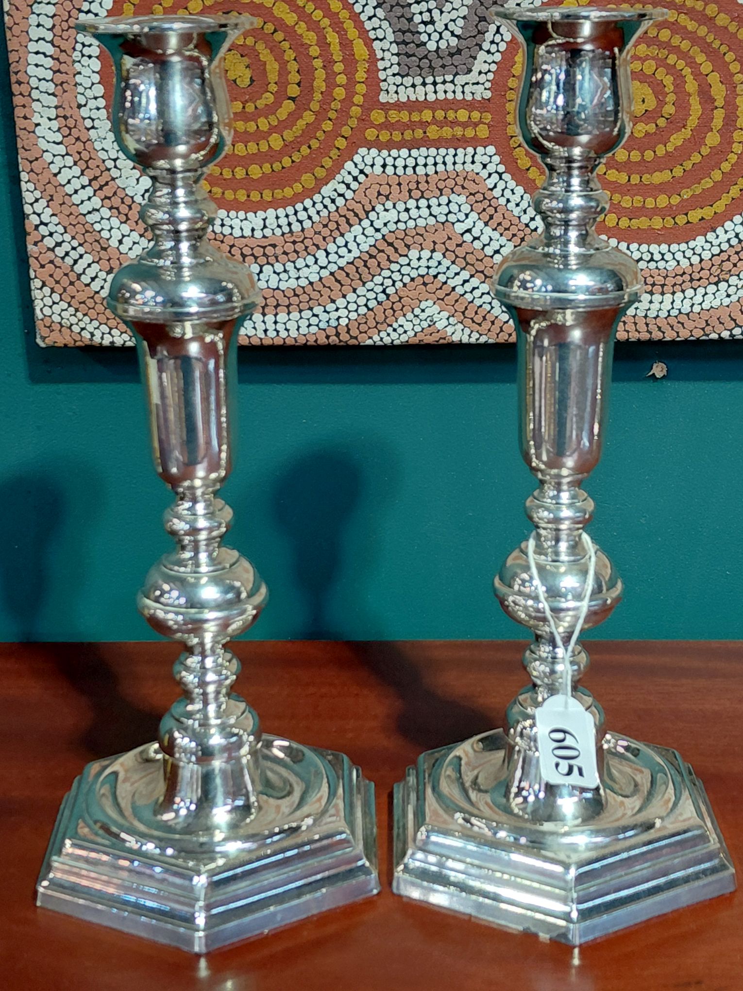 A PAIR OF SILVERPLATED CANDLESTICKS