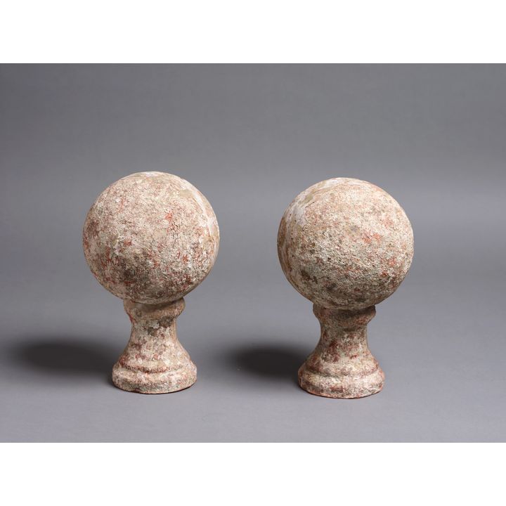 A pair of decorative earthenware orbs