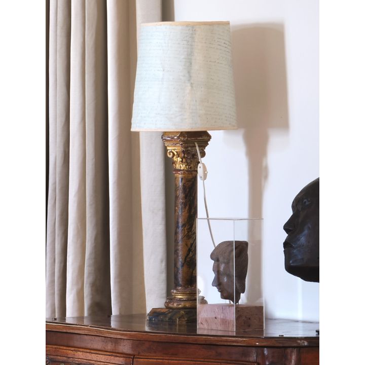 A pair of antique marbleised column table lamps