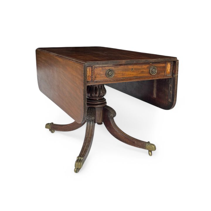 A Regency Irish mahogany drop flap pembroke dining table in the manner of Mack, Williams and Gibton